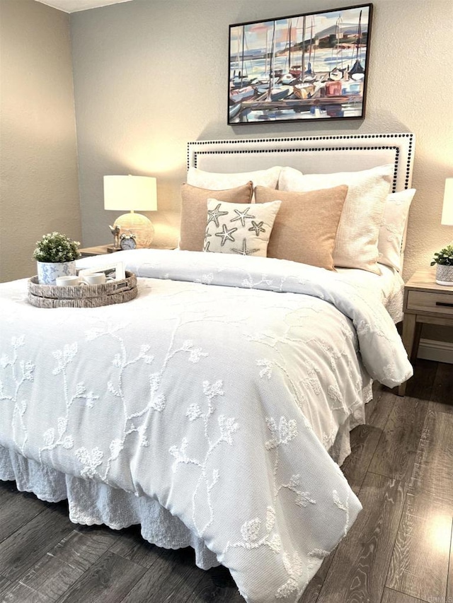 bedroom with wood finished floors