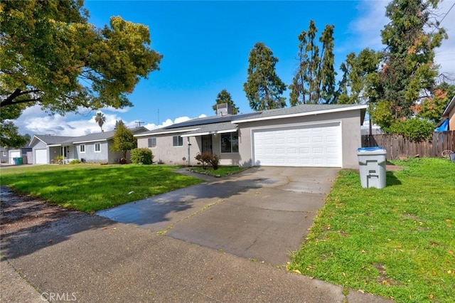 single story home featuring a front yard, concrete driveway, fence, and stucco siding