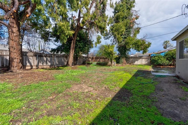 view of yard featuring a fenced backyard