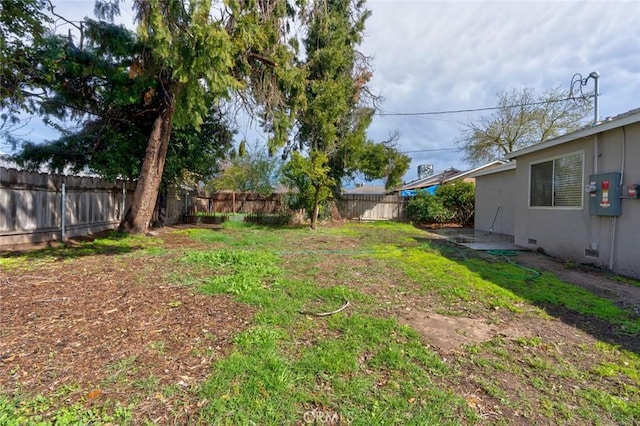 view of yard featuring a fenced backyard