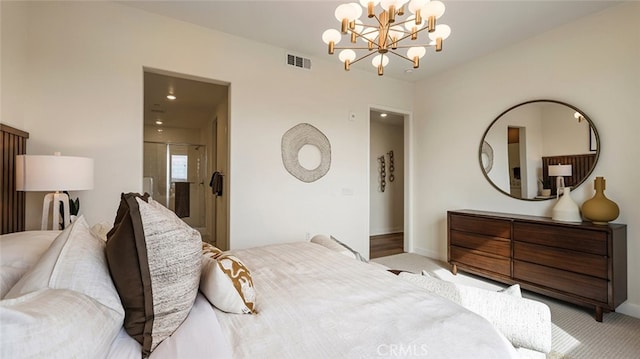 carpeted bedroom with visible vents, baseboards, and a notable chandelier