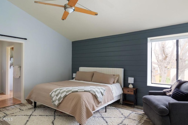 bedroom with wood finished floors, ceiling fan, and vaulted ceiling