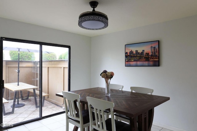 dining area featuring light tile patterned flooring