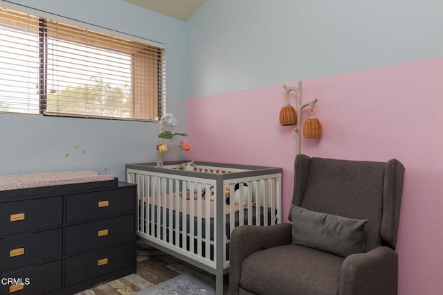 bedroom with a nursery area