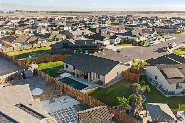 birds eye view of property with a residential view