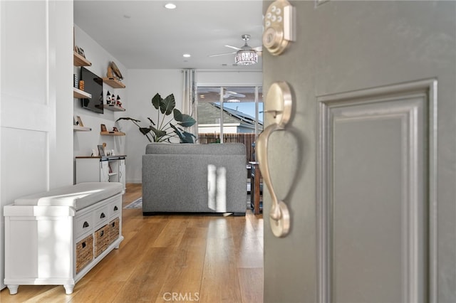 living area featuring recessed lighting, light wood-type flooring, and ceiling fan