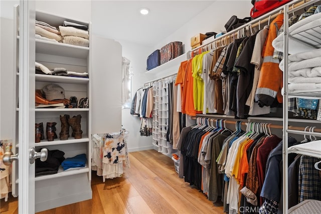 walk in closet featuring light wood-style flooring