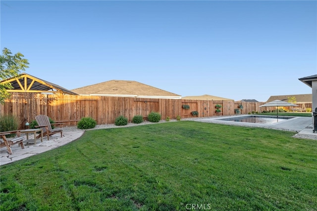 view of yard with a patio and a fenced backyard