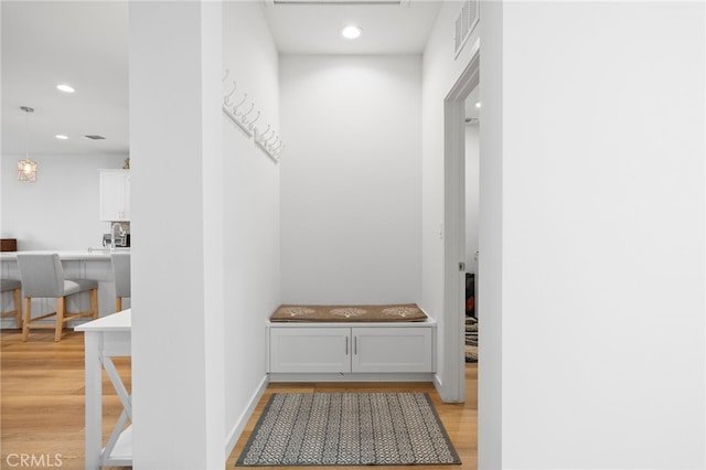 mudroom featuring visible vents, recessed lighting, light wood-type flooring, and baseboards