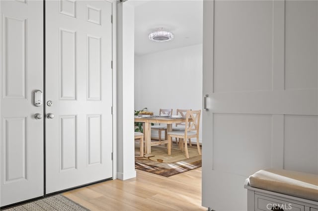 hallway featuring light wood-style floors