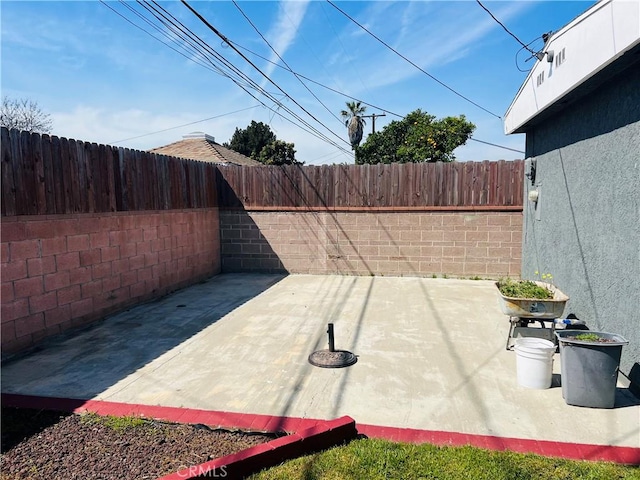 view of patio with a fenced backyard