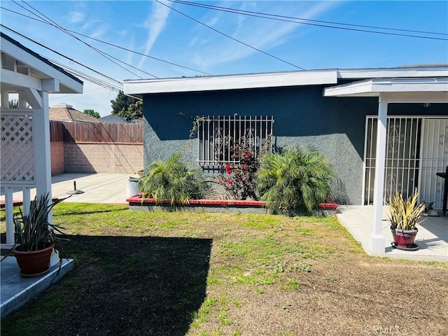 view of yard with a patio and fence