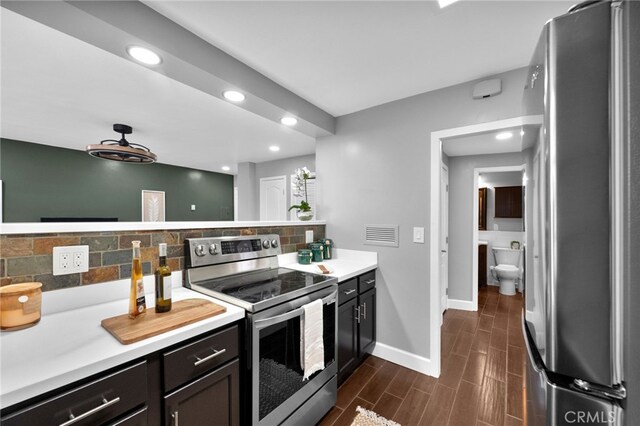 100 Atlantic Ave Unit 205, Long Beach, CA 90802 - kitchen featuring stainless steel appliances, backsplash, recessed lighting, light countertops, and baseboards
