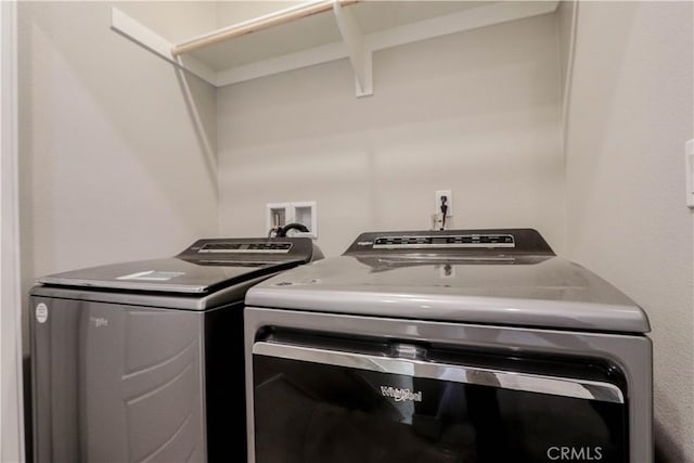 washroom with laundry area and washing machine and clothes dryer