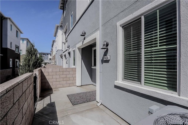 view of patio with fence and a residential view