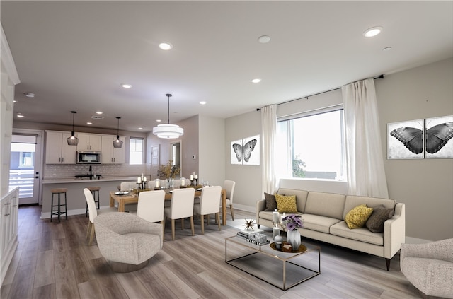 living room featuring recessed lighting and wood finished floors