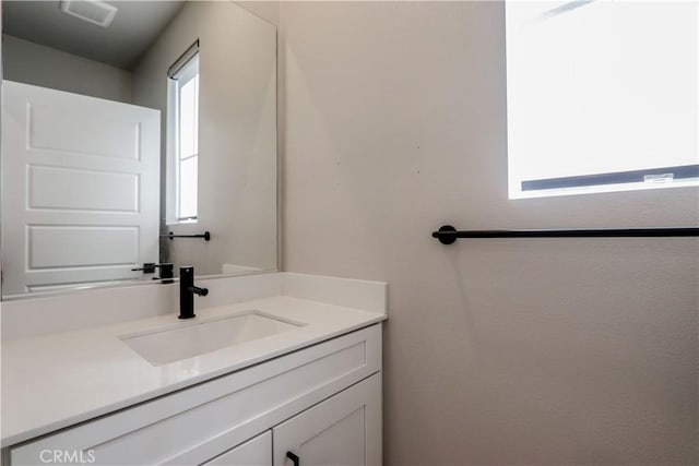 bathroom featuring vanity and visible vents