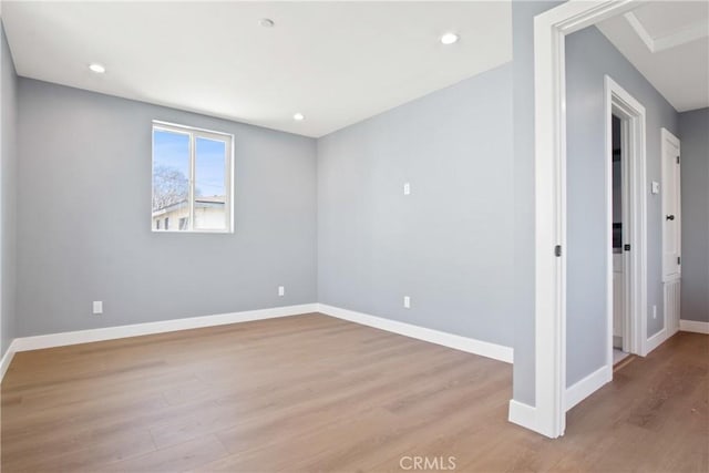 unfurnished room featuring recessed lighting, baseboards, and light wood finished floors