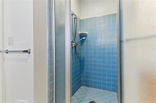 bathroom featuring a stall shower