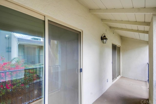 entrance to property with stucco siding