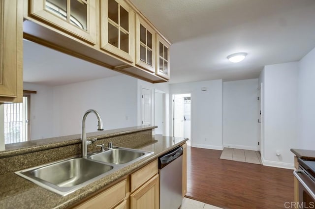 1045 Peach Ave Unit 12, El Cajon, CA 92021 - kitchen with appliances with stainless steel finishes, a sink, light wood finished floors, glass insert cabinets, and baseboards