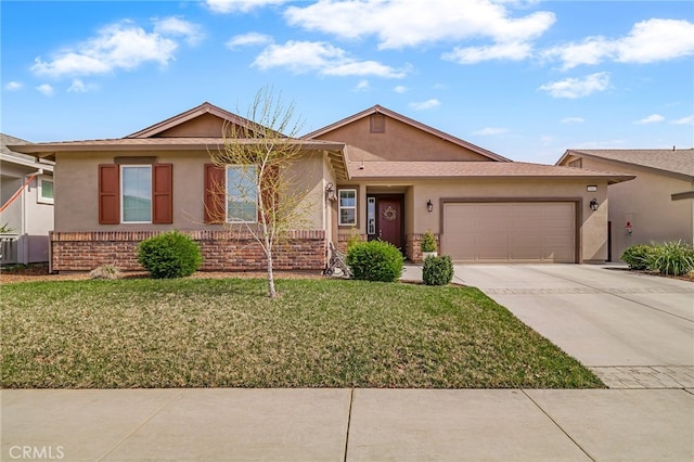 ranch-style house with stucco siding, concrete driveway, a front lawn, a garage, and brick siding