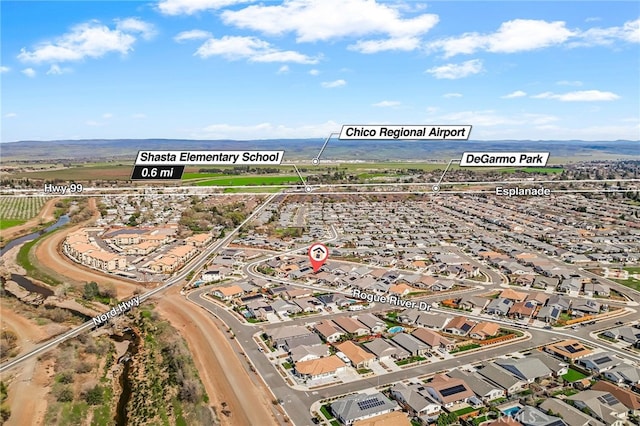 birds eye view of property with a residential view