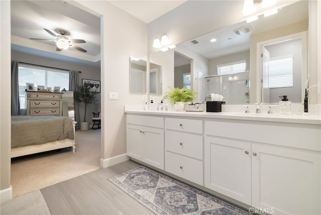 3460 Rogue River Dr, Chico, CA 95973 - full bath with a shower stall, plenty of natural light, ceiling fan, and double vanity