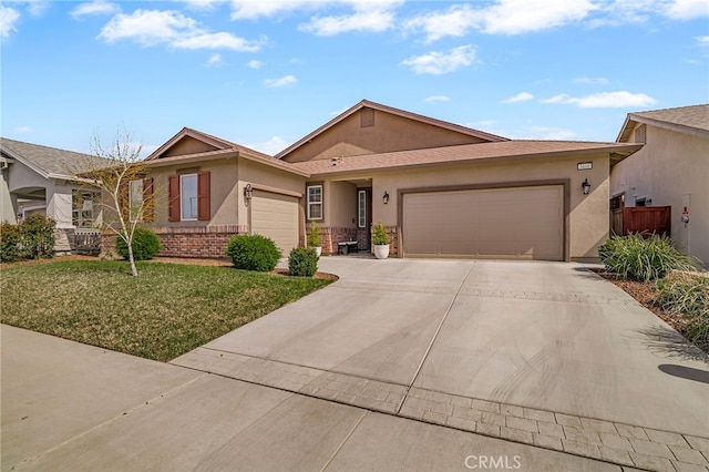 ranch-style house with fence, driveway, stucco siding, a front lawn, and a garage