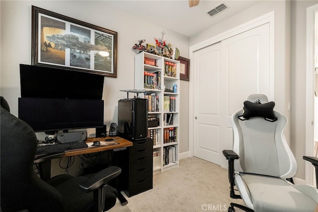 office space featuring visible vents and light colored carpet