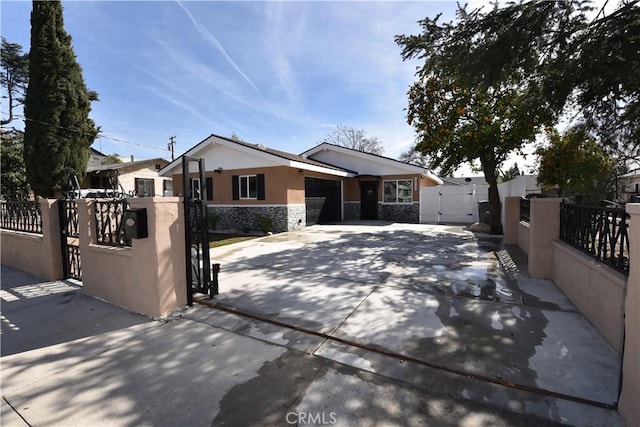 14730 Clark St, Baldwin Park, CA 91706 - ranch-style home featuring a gate, stone siding, driveway, an attached garage, and stucco siding