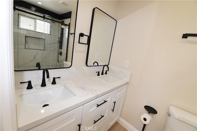 14730 Clark St, Baldwin Park, CA 91706 - full bath with a stall shower, toilet, double vanity, and baseboards