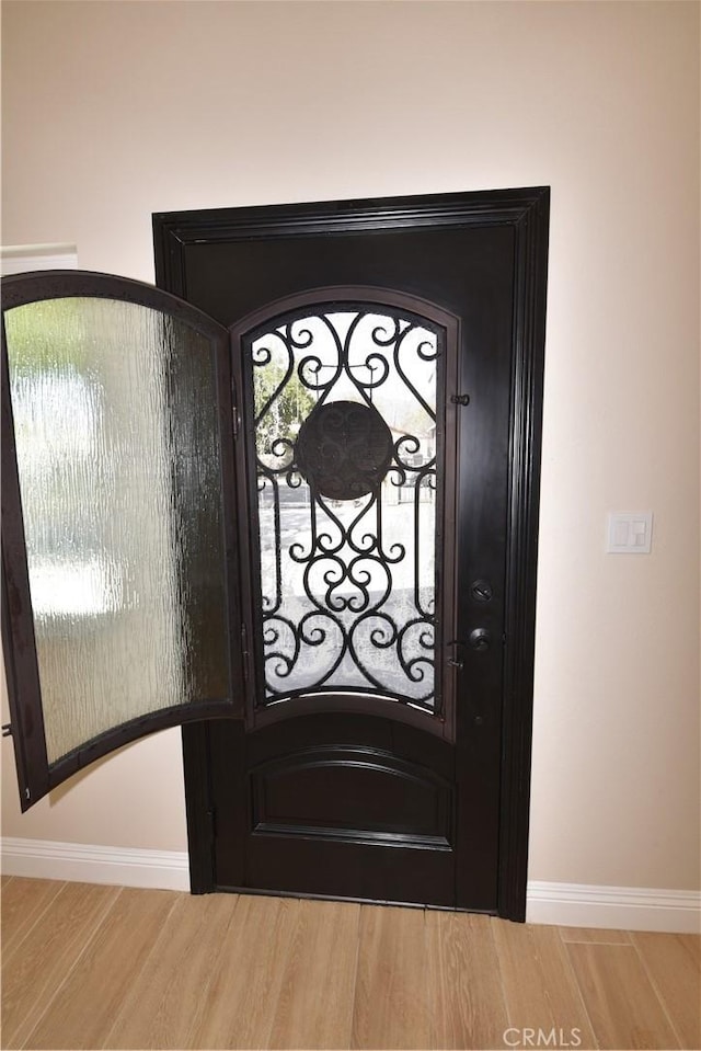 14730 Clark St, Baldwin Park, CA 91706 - detailed view of wood finished floors, baseboards, and a gate