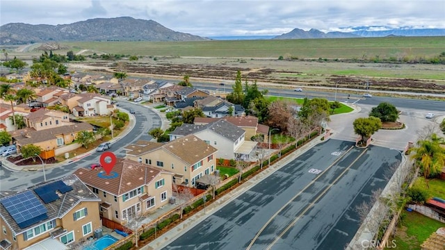 drone / aerial view with a residential view and a mountain view