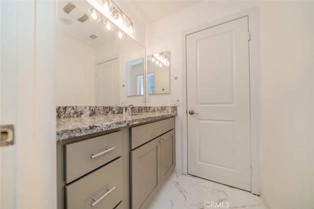 bathroom with visible vents, marble finish floor, and vanity