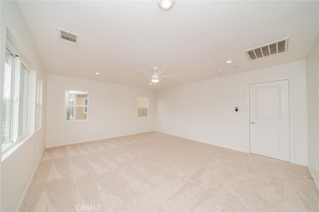 unfurnished room featuring recessed lighting, visible vents, light carpet, and a ceiling fan