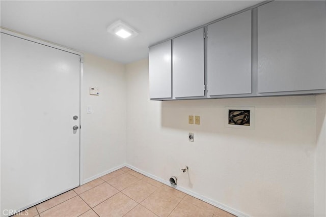 clothes washing area featuring light tile patterned floors, hookup for a washing machine, hookup for a gas dryer, cabinet space, and electric dryer hookup