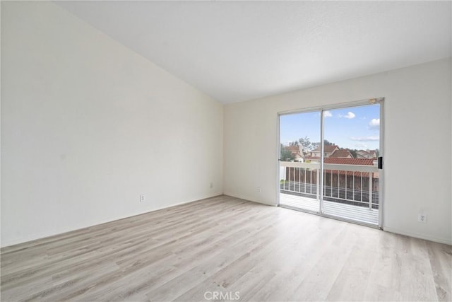 spare room featuring light wood-style flooring