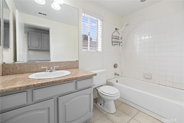 full bath featuring vanity, visible vents, tile patterned flooring, shower / bathing tub combination, and toilet