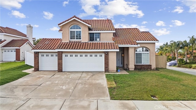 mediterranean / spanish home featuring a garage, stucco siding, a tile roof, and a front yard