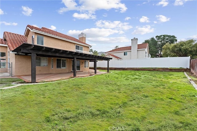 view of yard with a patio, a fenced backyard, and a pergola