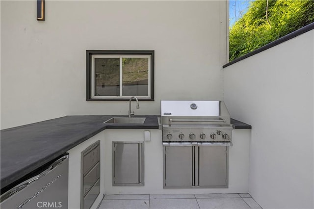 view of patio / terrace with a sink, area for grilling, and an outdoor kitchen