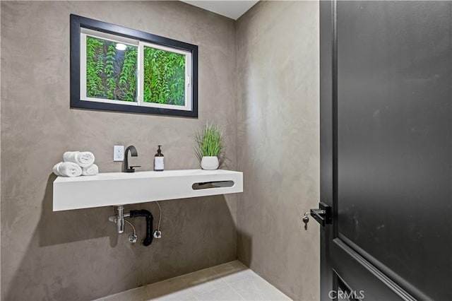 bathroom with tile patterned flooring