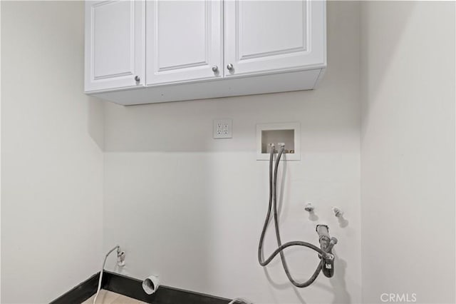 laundry room with washer hookup, cabinet space, and hookup for a gas dryer