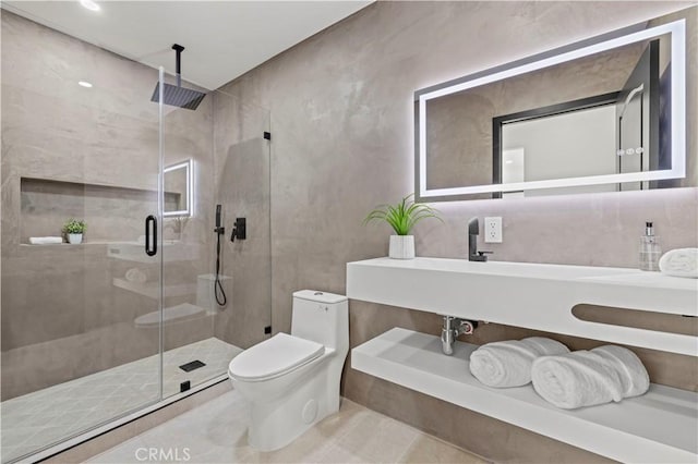 bathroom with a stall shower and toilet