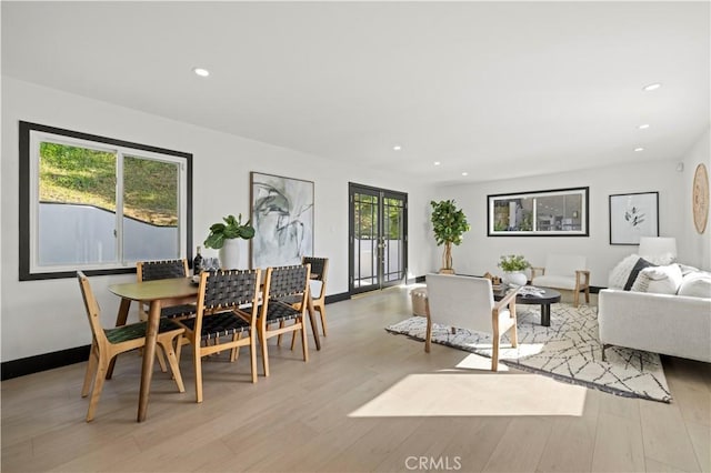 dining area featuring recessed lighting, light wood-type flooring, and baseboards