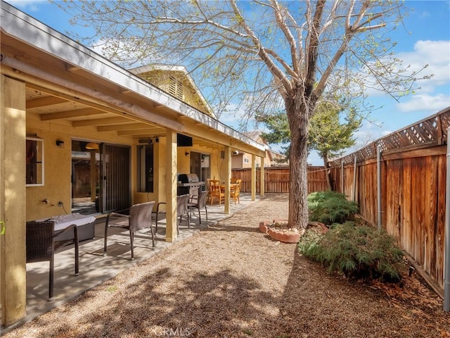 view of yard with a fenced backyard and a patio