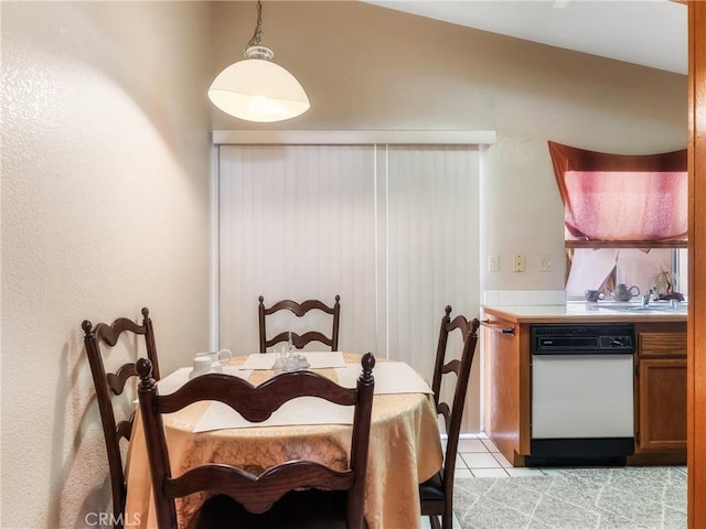 dining space featuring light tile patterned floors