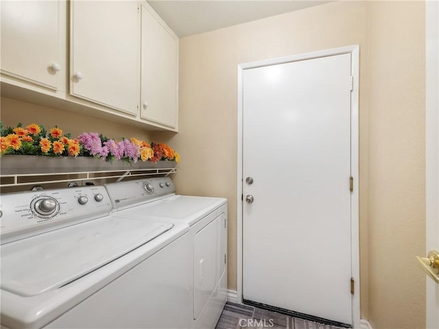 laundry room featuring cabinet space and washing machine and clothes dryer