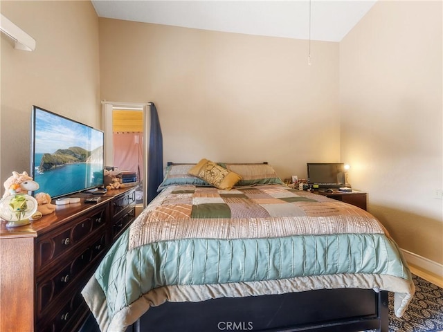 bedroom featuring baseboards